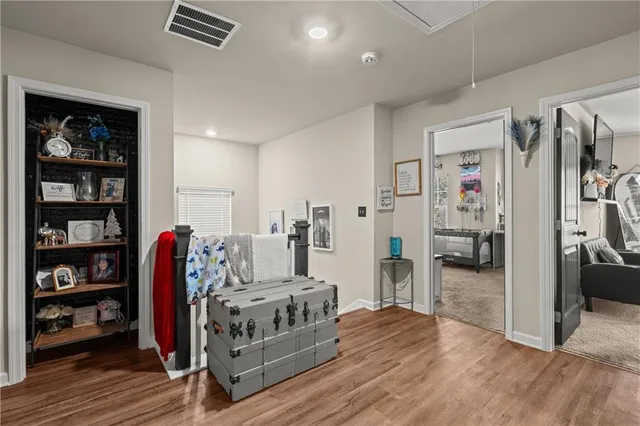 a view of a livingroom with furniture and closet