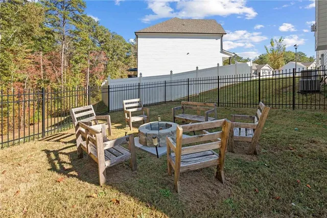 a view of a balcony with chairs and wooden floor