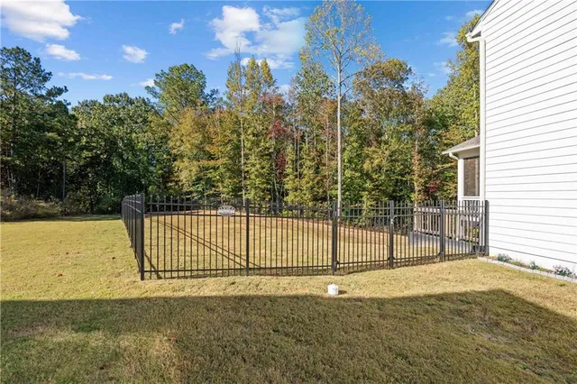 a balcony with furniture and a potted plant