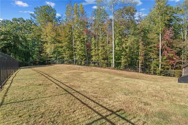 a spacious bathroom with a large tree