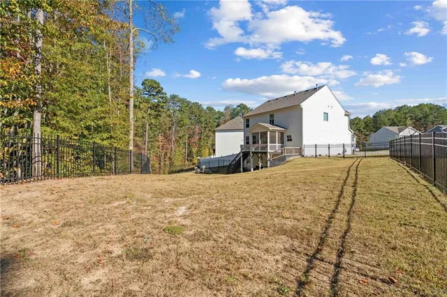 a view of a house with wooden deck