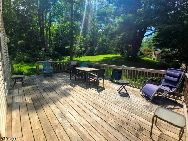 a view of backyard with sitting area