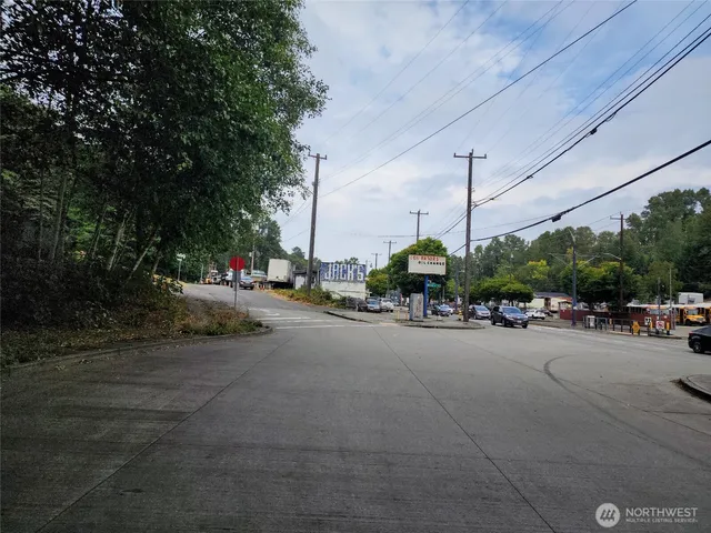 a view of a street with cars