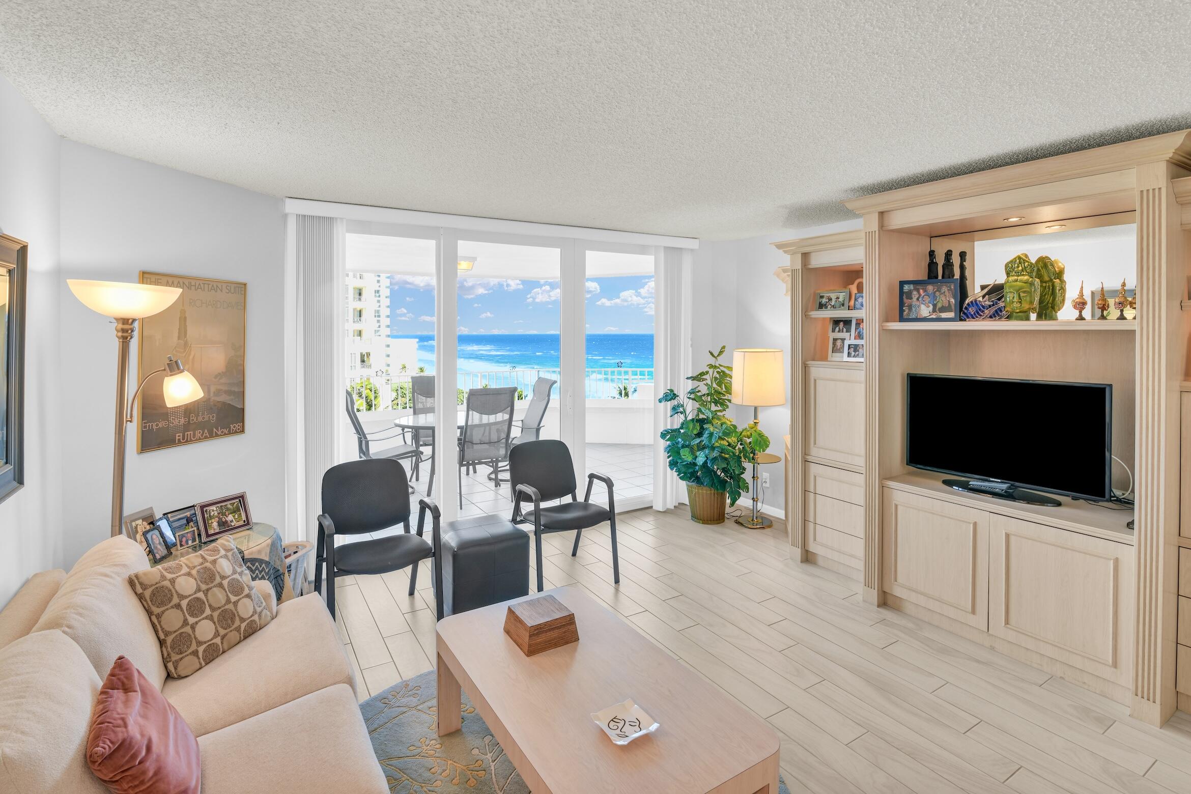 500 South Ocean Boulevard, Unit 803 Boca Raton, FL 33432 - Photo 1 of 72 a living room with furniture and a flat screen tv