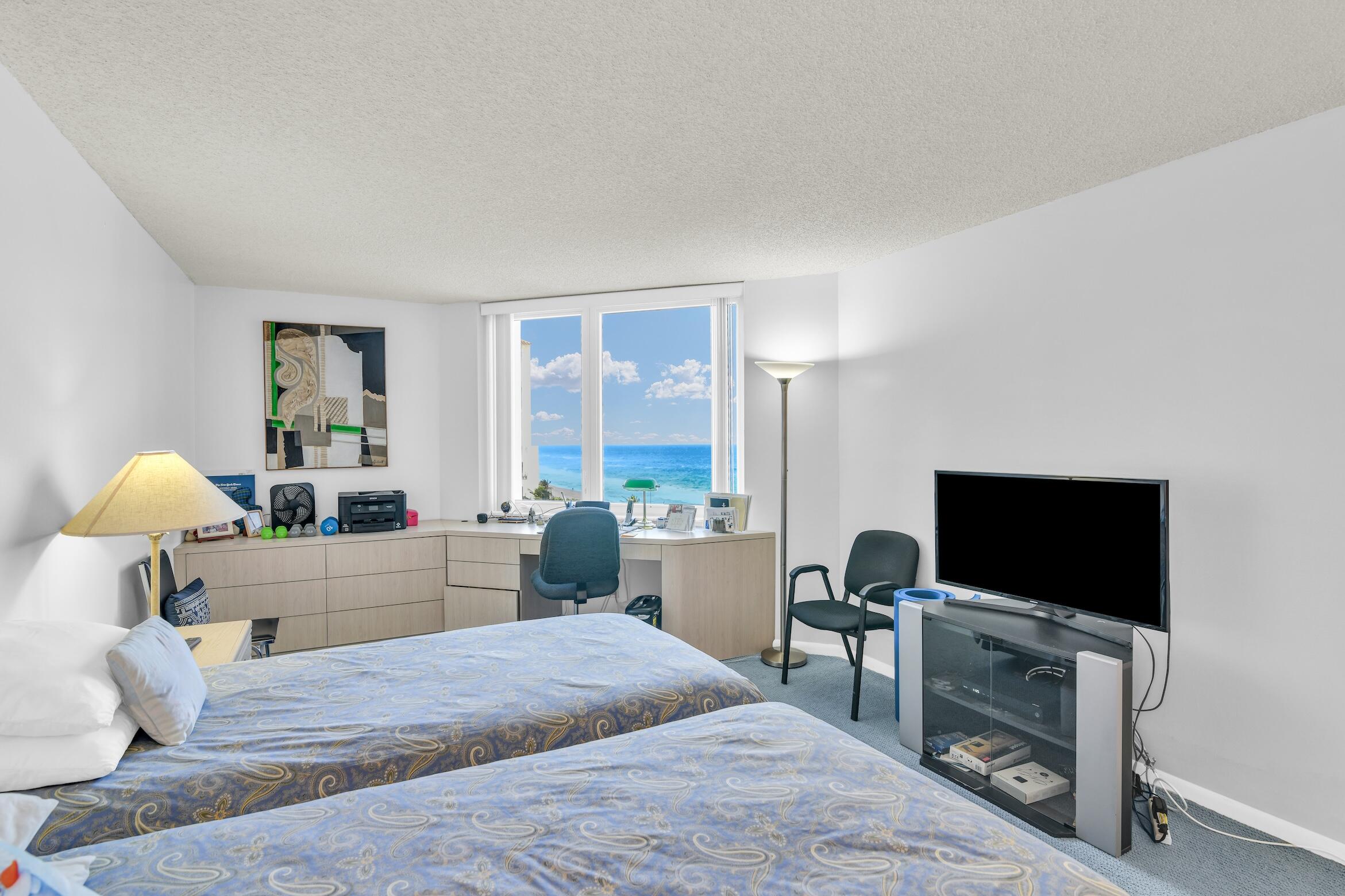 500 South Ocean Boulevard, Unit 803 Boca Raton, FL 33432 - Photo 14 of 72 a bedroom with a bed and a flat screen tv