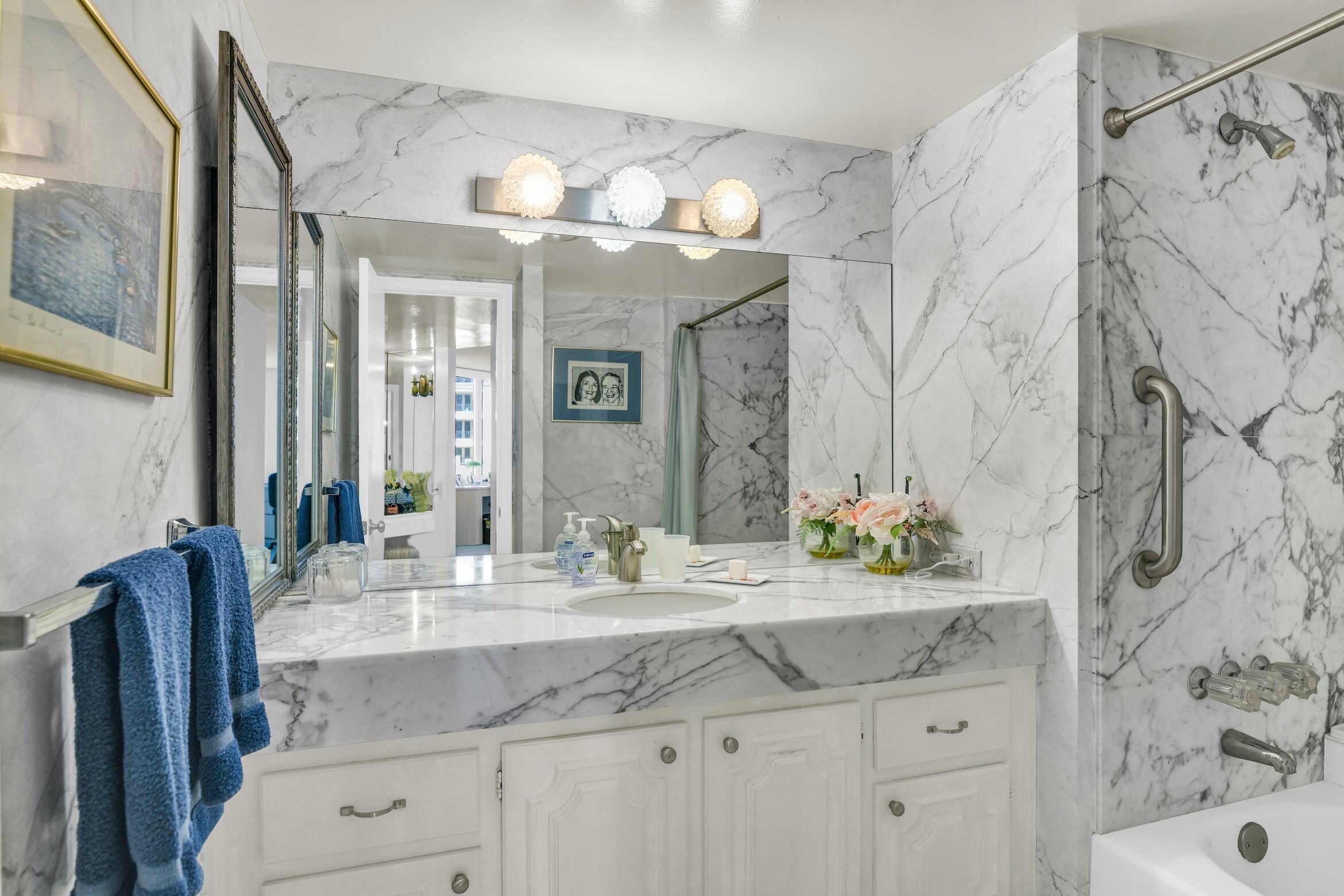 500 South Ocean Boulevard, Unit 803 Boca Raton, FL 33432 - Photo 16 of 72 a bathroom with a sink double vanity and a mirror