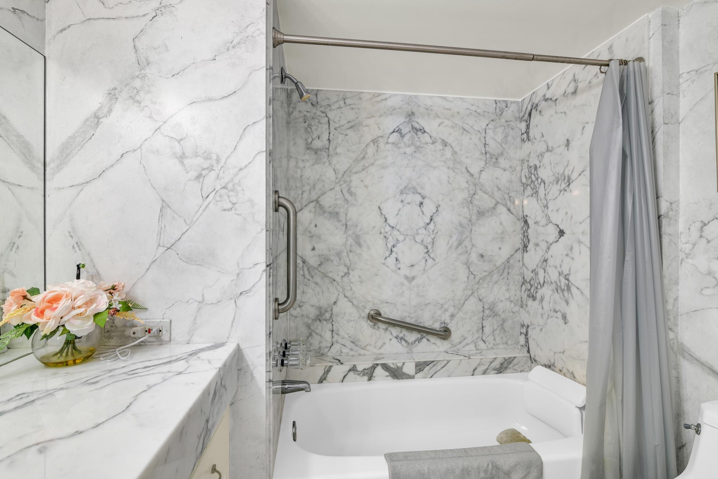 500 South Ocean Boulevard, Unit 803 Boca Raton, FL 33432 - Photo 17 of 72 a bathroom with a shower curtain and a sink