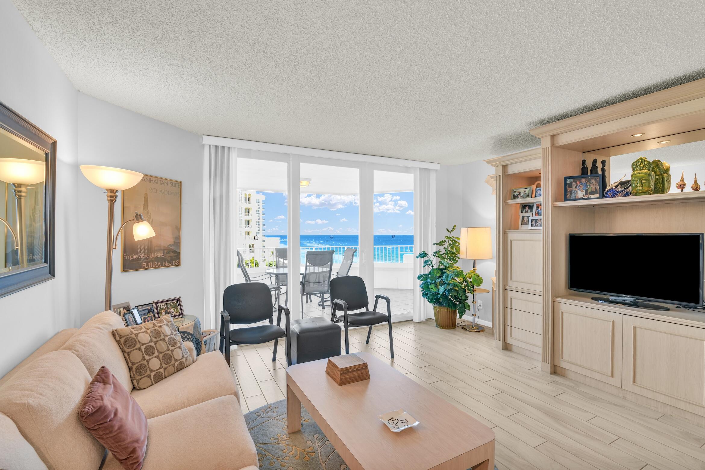 500 South Ocean Boulevard, Unit 803 Boca Raton, FL 33432 - Photo 5 of 72 a living room with furniture and a flat screen tv