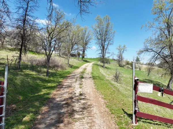 a view of a house with wooden deck