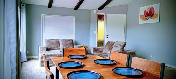 a view of a swimming pool with a table and chairs