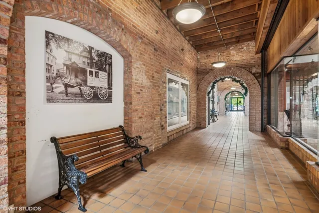 a view of a street with a house in the background