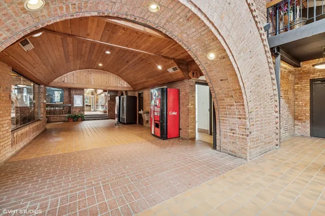 a view of a porch with wooden floor