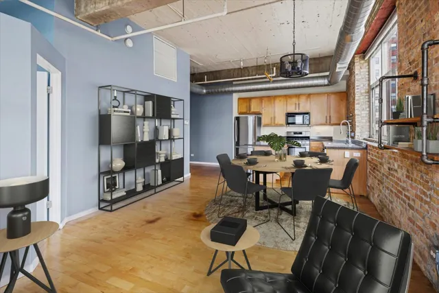 a view of a dining room with furniture window and wooden floor