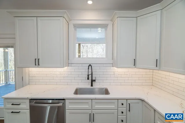 a kitchen with a sink and cabinets