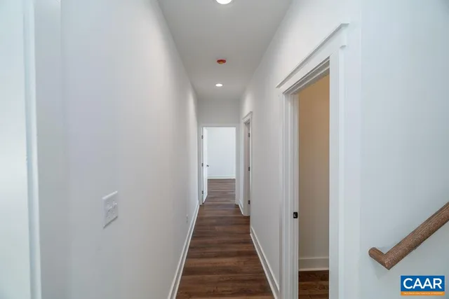 a view of a hallway with the wooden floor