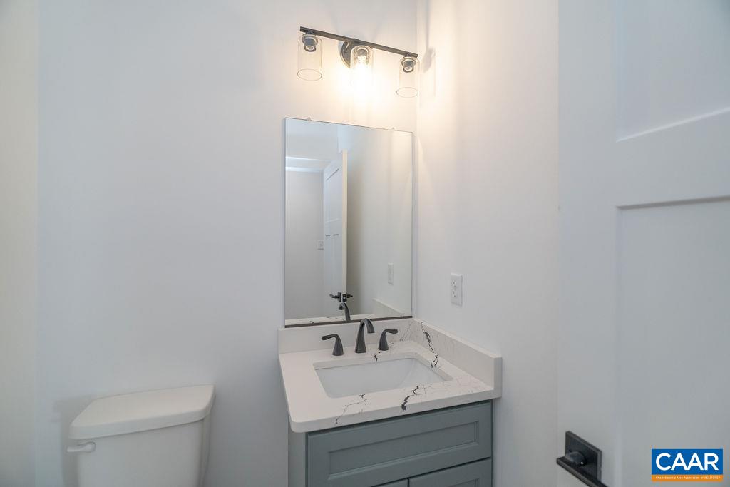 Lot 5 Frays Mill Road Ruckersville, VA 22968 - Photo 21 of 54 a bathroom with a sink a toilet and mirror