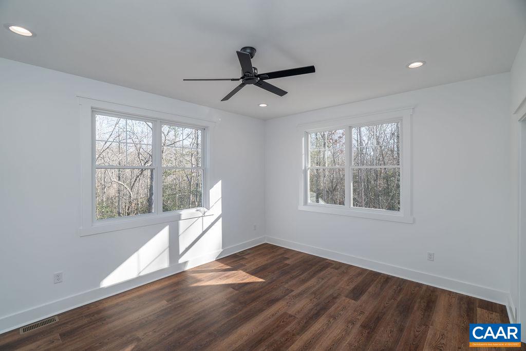 Lot 5 Frays Mill Road Ruckersville, VA 22968 - Photo 22 of 54 a view of an empty room with wooden floor and a window