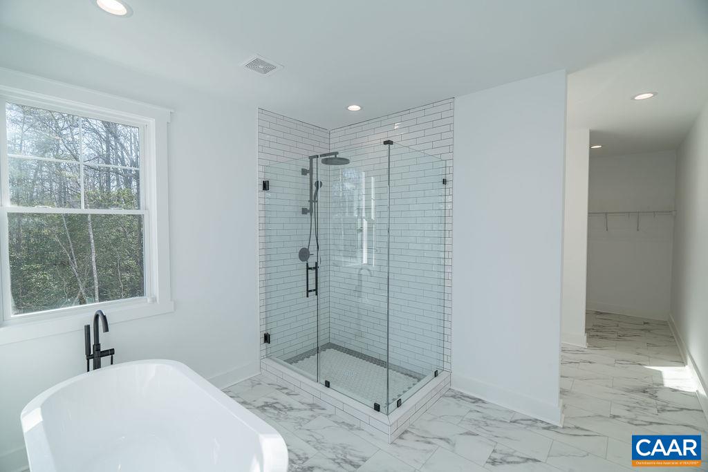 Lot 5 Frays Mill Road Ruckersville, VA 22968 - Photo 23 of 54 a bathroom with a shower sink and mirror