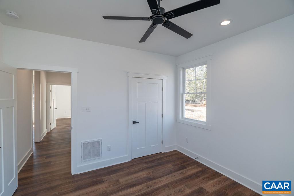 Lot 5 Frays Mill Road Ruckersville, VA 22968 - Photo 32 of 54 a view of empty room with wooden floor and fan