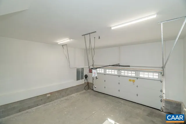 a living room with a table chair and a window