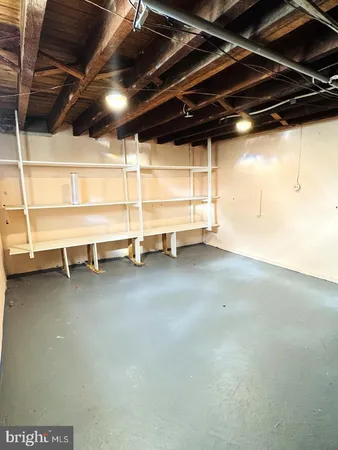 a view of an empty room with a storage