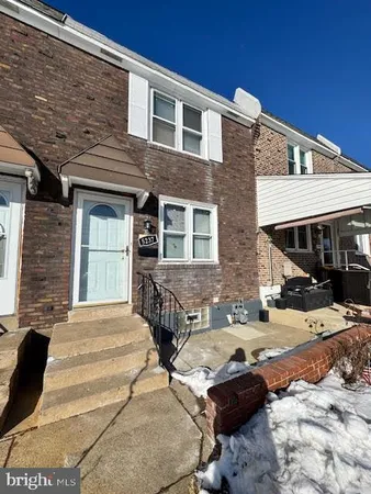 a front view of a house with parking space