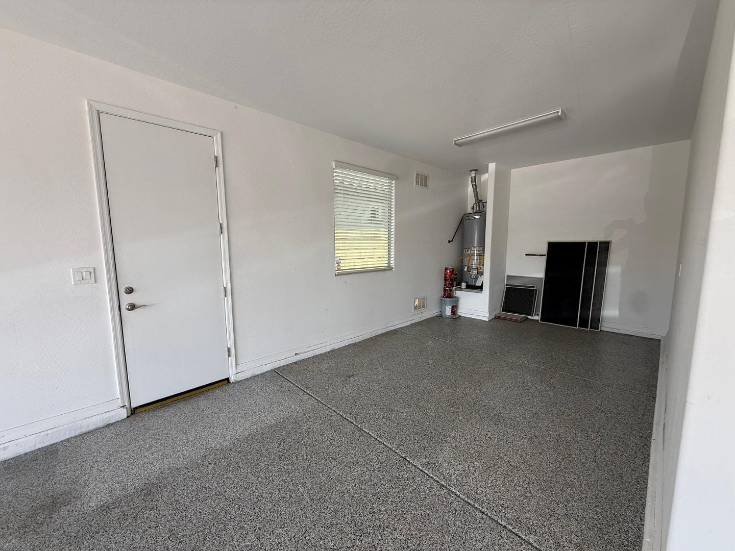 15744 West Jefferson Street Goodyear, AZ 85338 - Photo 26 of 26 a view of a livingroom with an empty space and a fireplace