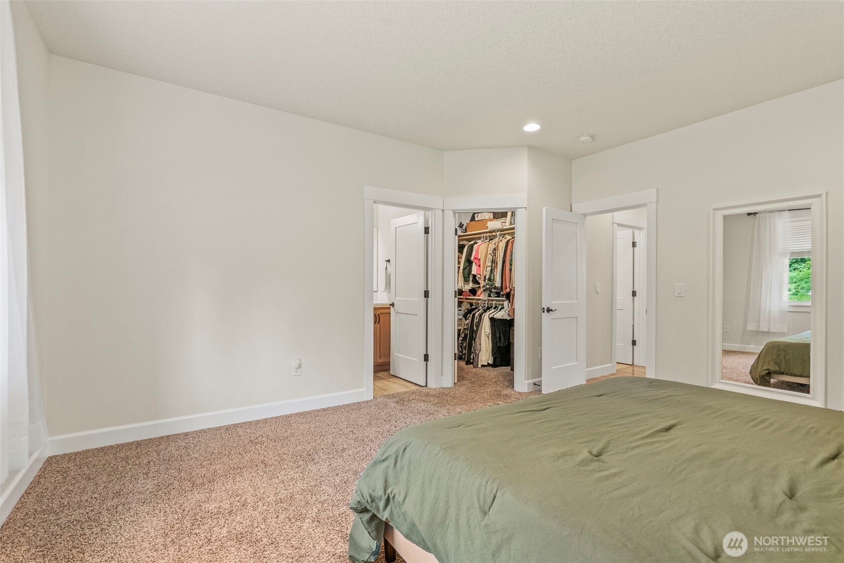 266 Fir Road Ariel, WA 98603 - Photo 15 of 32 a view of a bedroom with wooden floor and closet