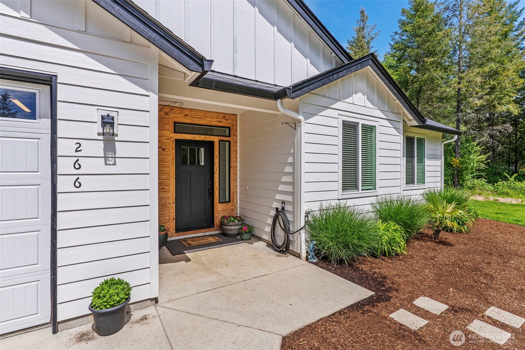 266 Fir Road Ariel, WA 98603 - Photo 2 of 32 a view of a house with potted plants