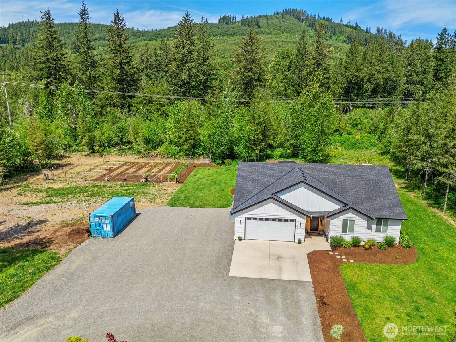 266 Fir Road Ariel, WA 98603 - Photo 29 of 32 an aerial view of a house with swimming pool and green yard