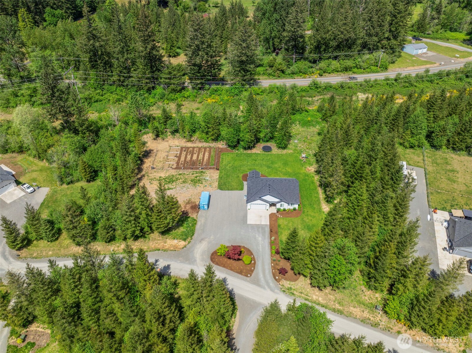 266 Fir Road Ariel, WA 98603 - Photo 30 of 32 an aerial view of a house with a yard