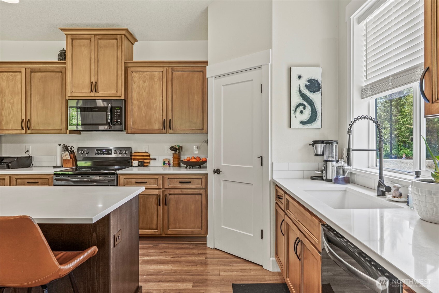 266 Fir Road Ariel, WA 98603 - Photo 5 of 32 a kitchen with stainless steel appliances granite countertop a sink stove and cabinets
