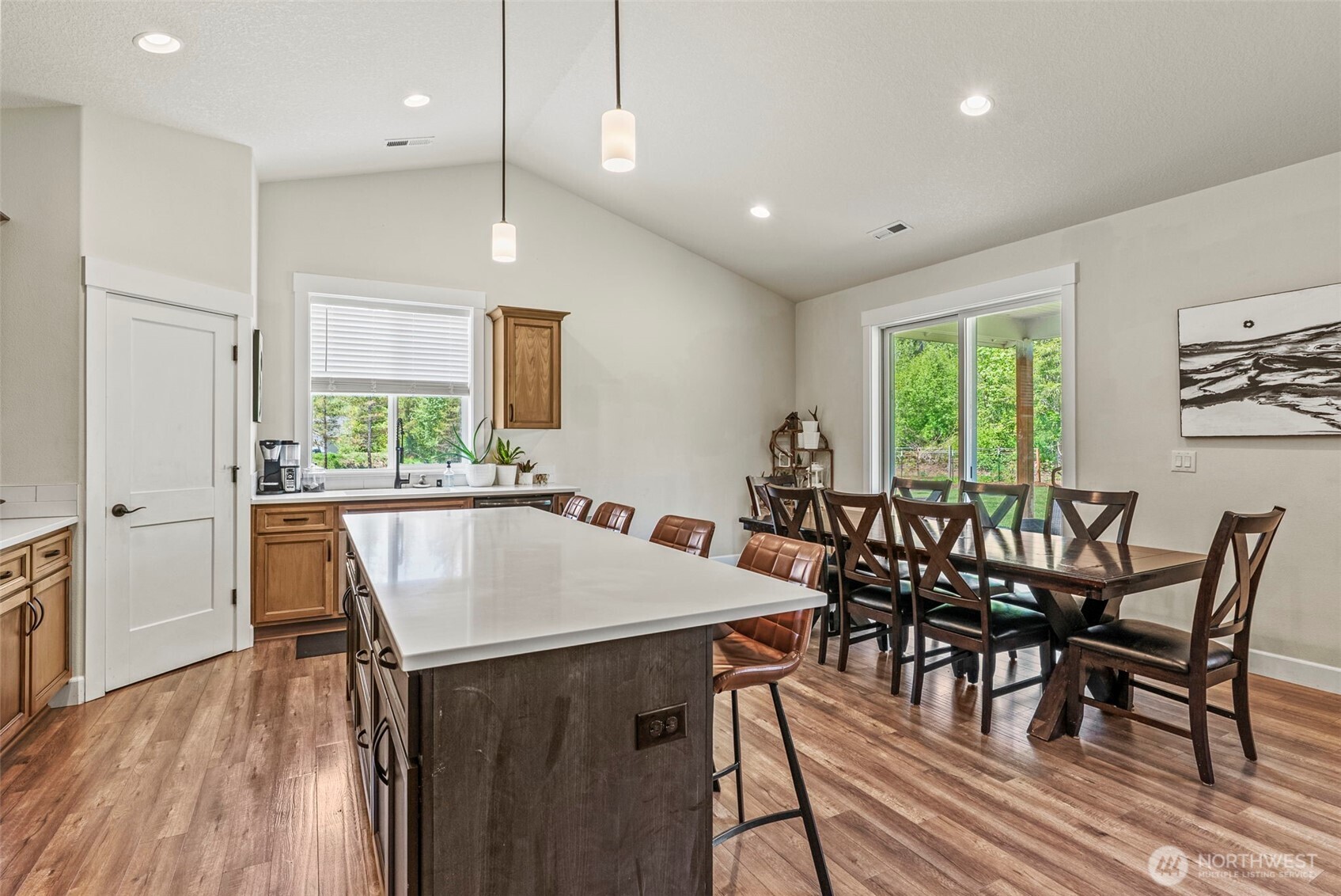 266 Fir Road Ariel, WA 98603 - Photo 7 of 32 a view of a dining room with furniture window and wooden floor