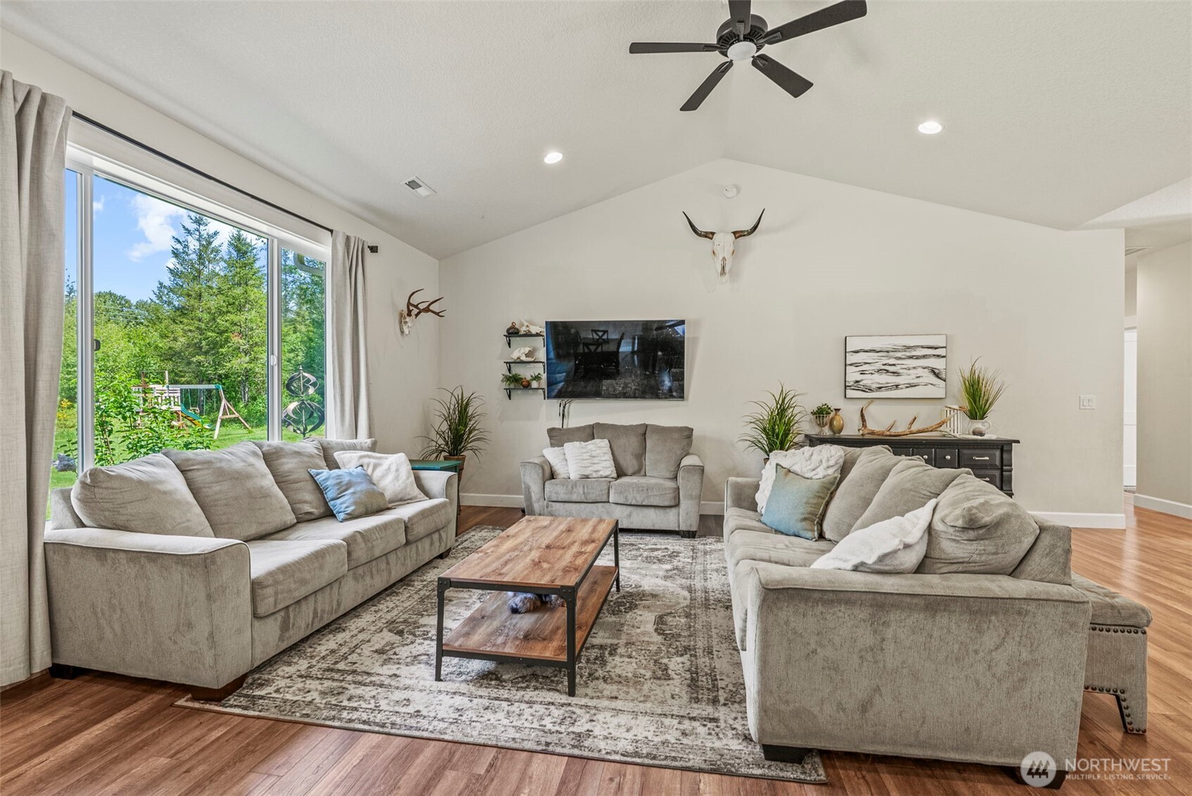 266 Fir Road Ariel, WA 98603 - Photo 10 of 32 a living room with furniture and a flat screen tv