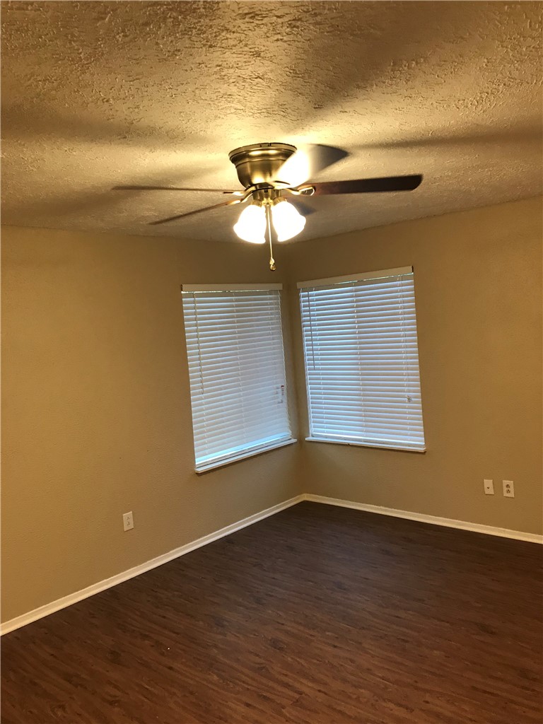 3201 Cougar Trail, Unit A Bryan, TX 77807 - Photo 2 of 15 a view of room with hardwood floor and ceiling fan