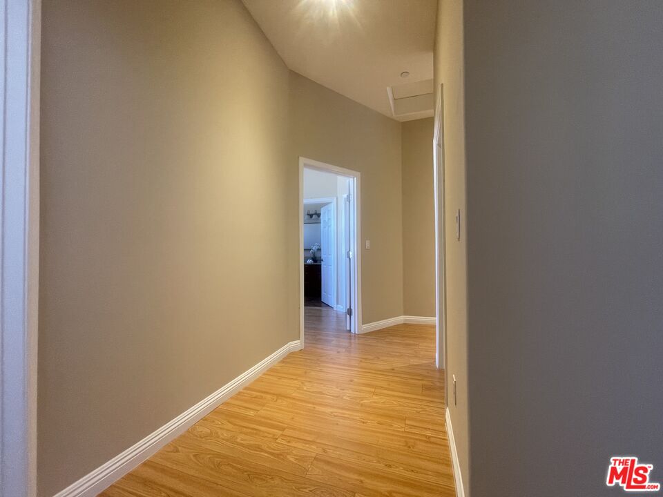 904 East Windsor Road, Unit 103 Glendale, CA 91205 - Photo 14 of 26 a view of a hallway with wooden floor