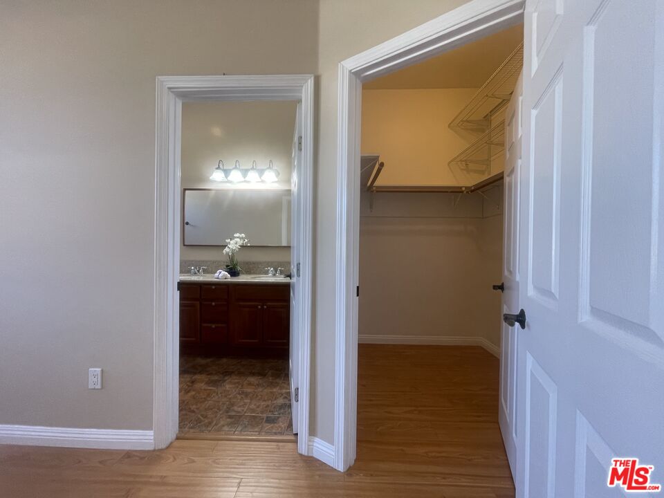 904 East Windsor Road, Unit 103 Glendale, CA 91205 - Photo 16 of 26 a bathroom with a granite countertop sink and a mirror