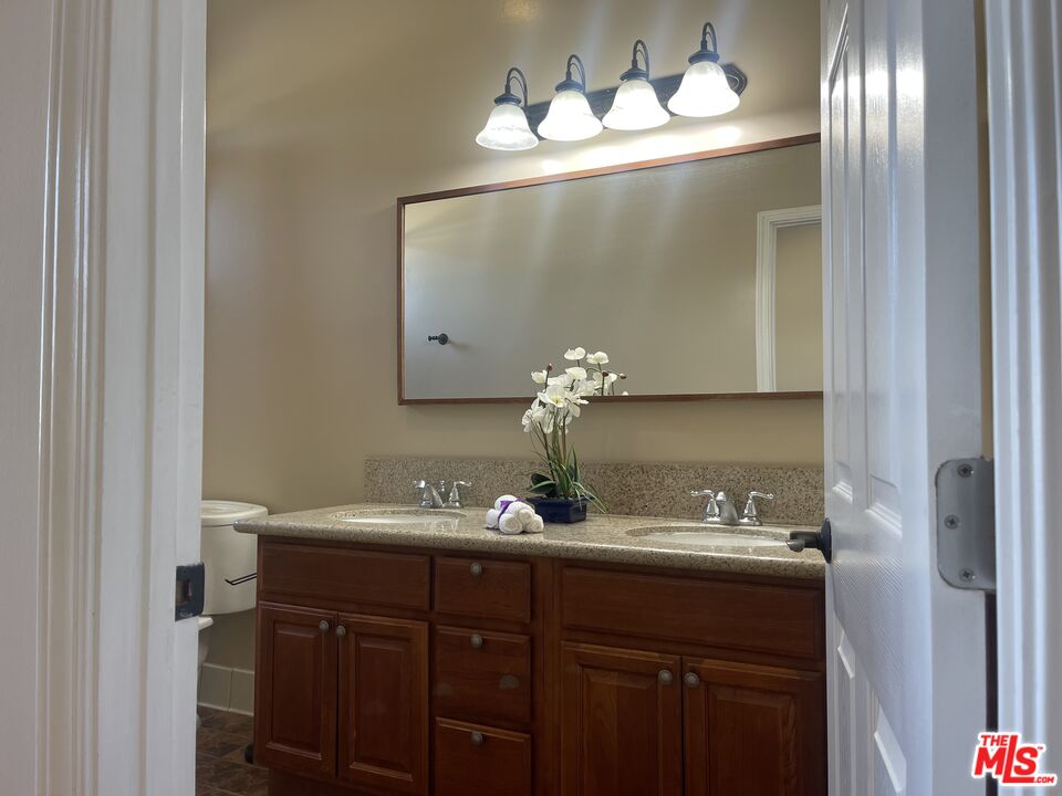 904 East Windsor Road, Unit 103 Glendale, CA 91205 - Photo 19 of 26 a bathroom with a sink and a mirror