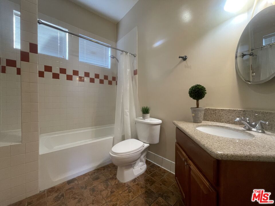 904 East Windsor Road, Unit 103 Glendale, CA 91205 - Photo 23 of 26 a bathroom with a sink and a mirror