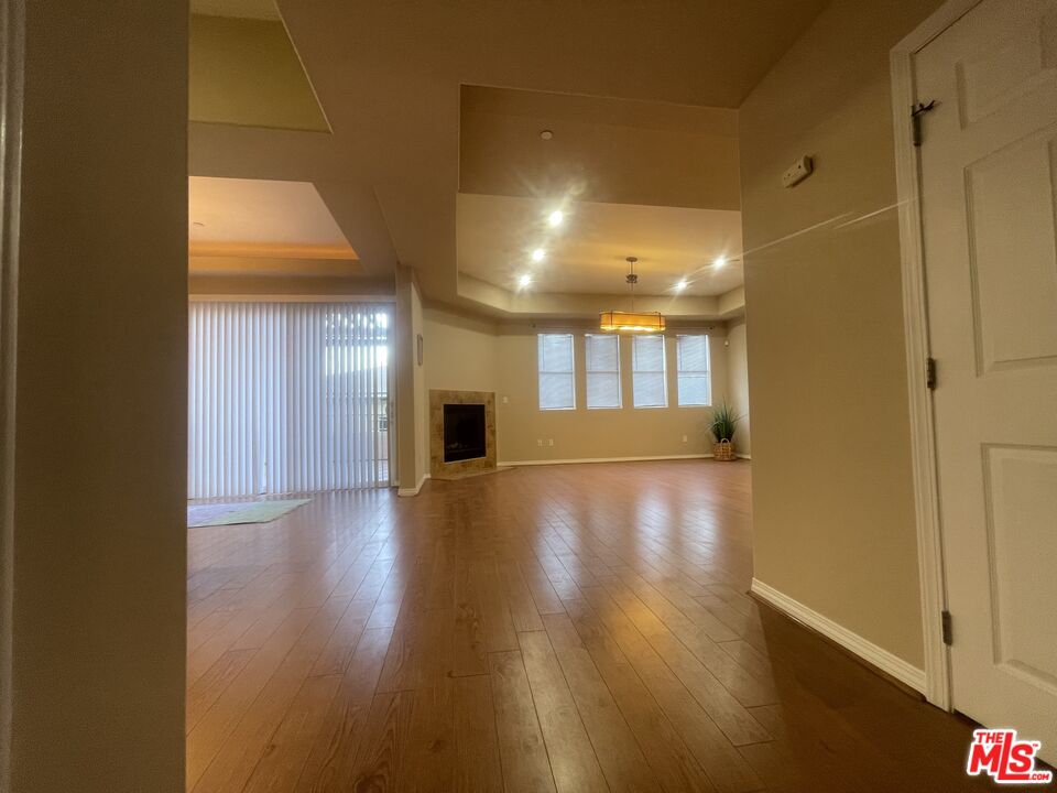904 East Windsor Road, Unit 103 Glendale, CA 91205 - Photo 4 of 26 a view of a hallway with wooden floor