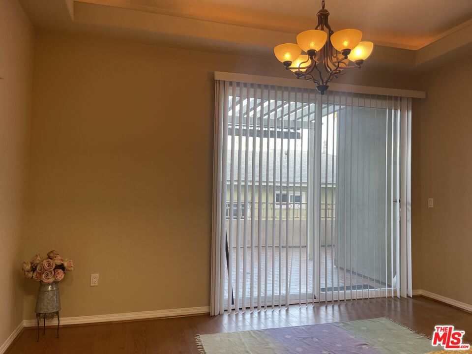 904 East Windsor Road, Unit 103 Glendale, CA 91205 - Photo 7 of 26 a view of a livingroom with a chandelier