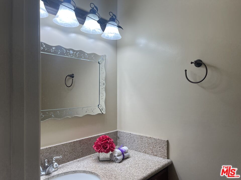 904 East Windsor Road, Unit 103 Glendale, CA 91205 - Photo 10 of 26 a bathroom with a sink and a mirror
