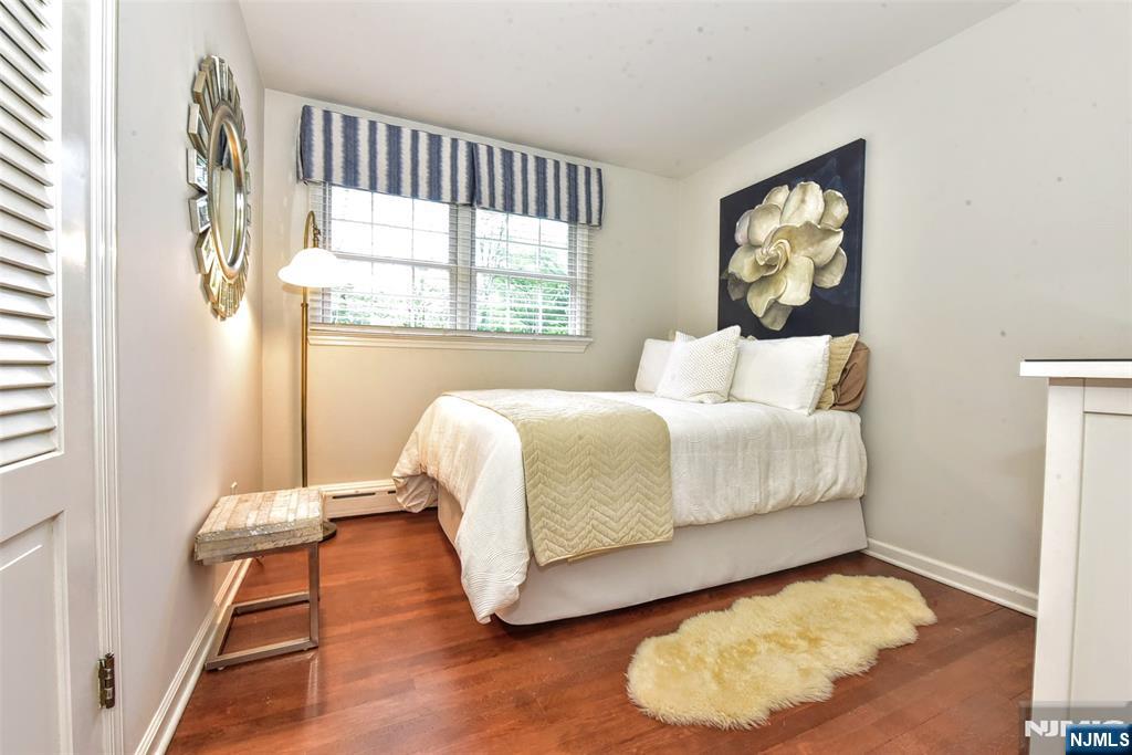 60 Dimmig Road Upper Saddle River, NJ 07458 - Photo 28 of 40 a bedroom with a bed and a window