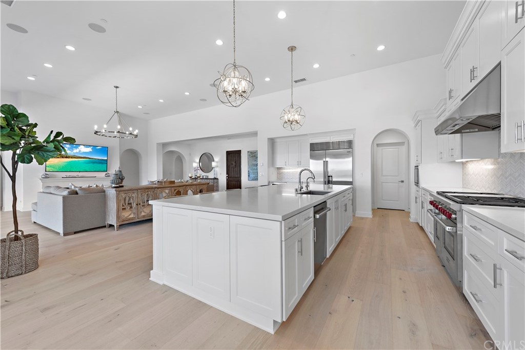 9 Catalina Vista Road Ladera Ranch, CA 92694 - Photo 11 of 41 a large kitchen with stainless steel appliances lots of counter space and a sink in it