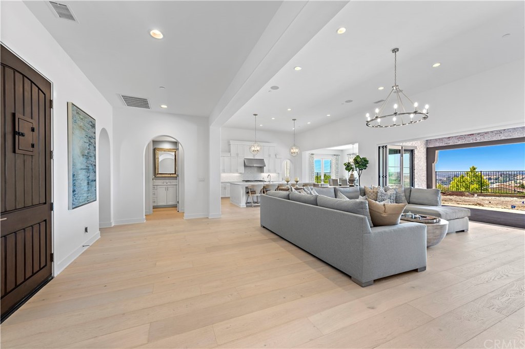9 Catalina Vista Road Ladera Ranch, CA 92694 - Photo 12 of 41 a living room with furniture and a chandelier