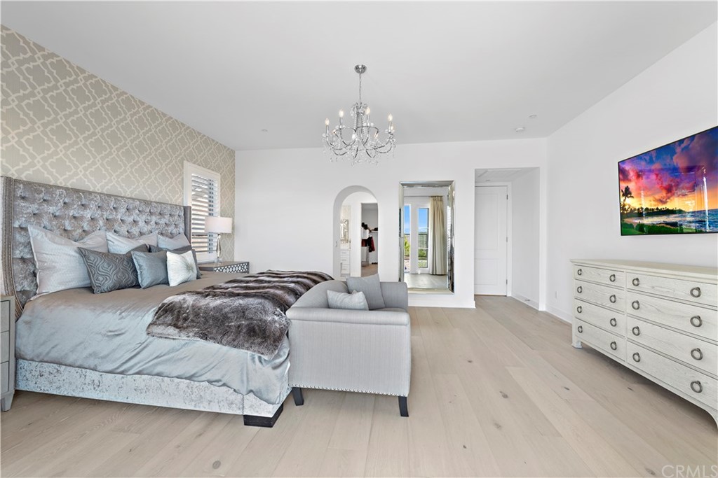9 Catalina Vista Road Ladera Ranch, CA 92694 - Photo 15 of 41 a spacious bedroom with a bed and a flat screen tv