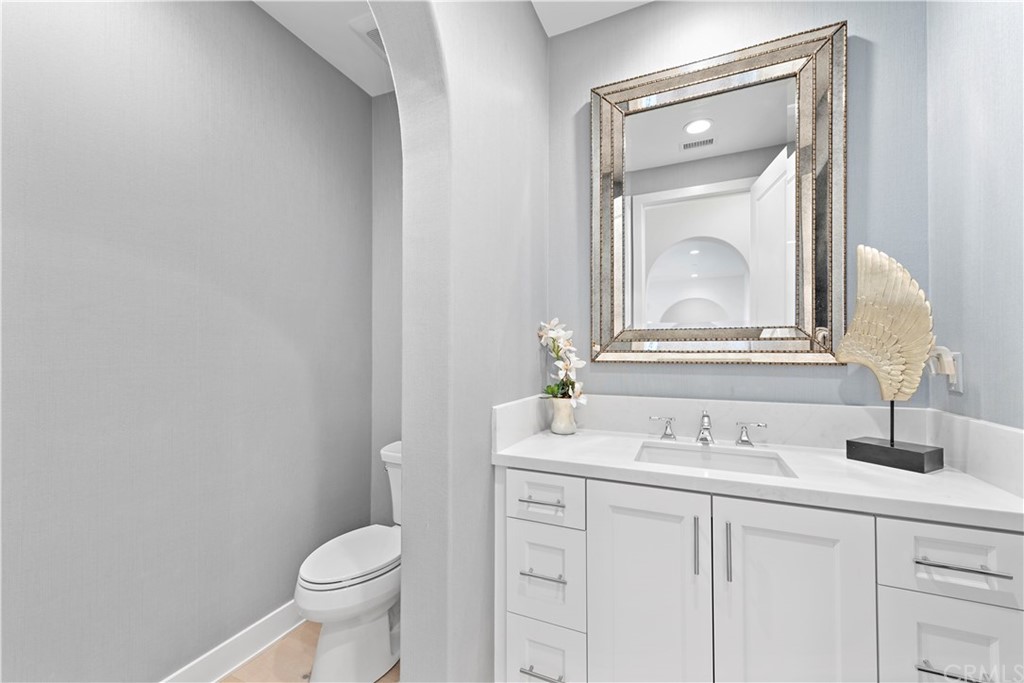 9 Catalina Vista Road Ladera Ranch, CA 92694 - Photo 20 of 41 a bathroom with a toilet sink and mirror