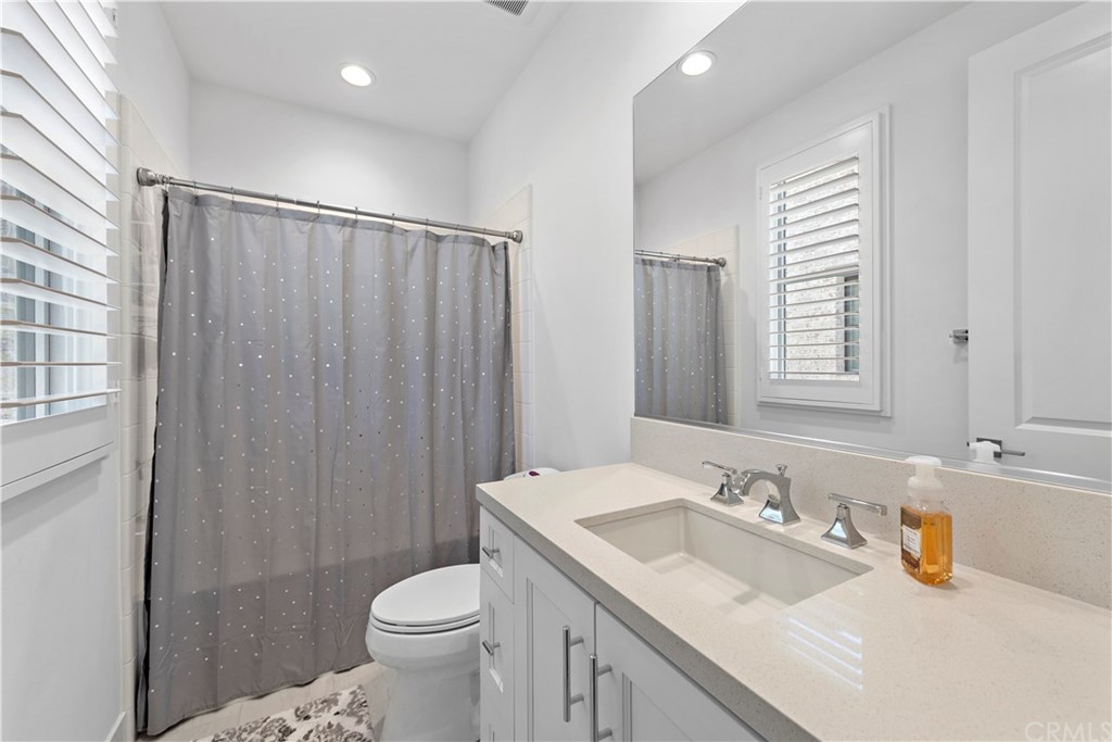 9 Catalina Vista Road Ladera Ranch, CA 92694 - Photo 26 of 41 a bathroom with a granite countertop sink toilet and shower