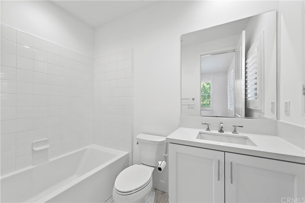 9 Catalina Vista Road Ladera Ranch, CA 92694 - Photo 28 of 41 a bathroom with a toilet a sink a mirror a bathtub and vanity