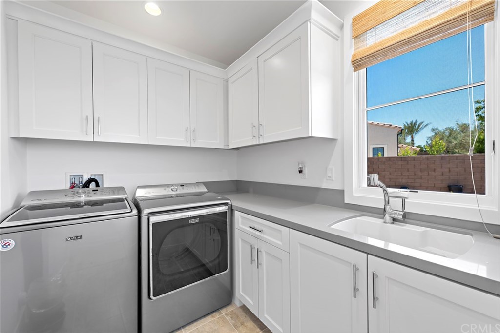9 Catalina Vista Road Ladera Ranch, CA 92694 - Photo 31 of 41 a kitchen with appliances cabinets and a sink